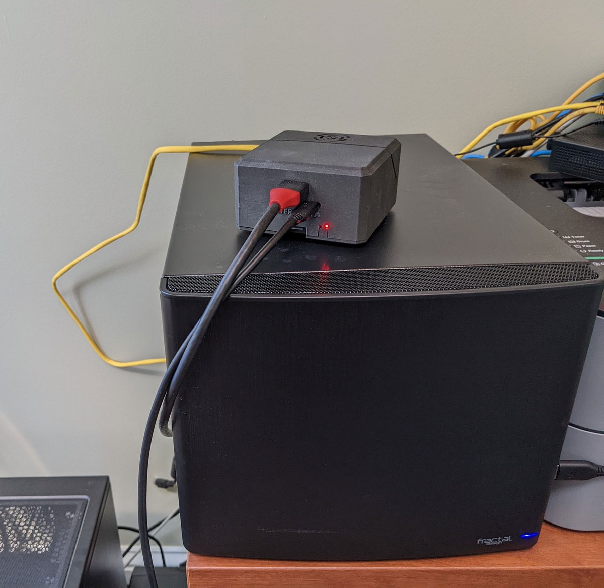 Photo of Voyager 2 PoE device on top of TrueNAS server