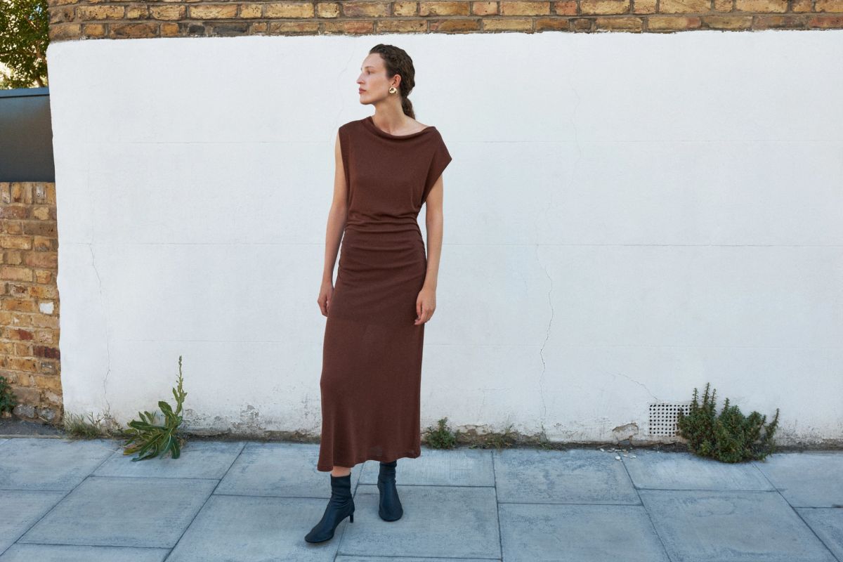 woman standing by white wall