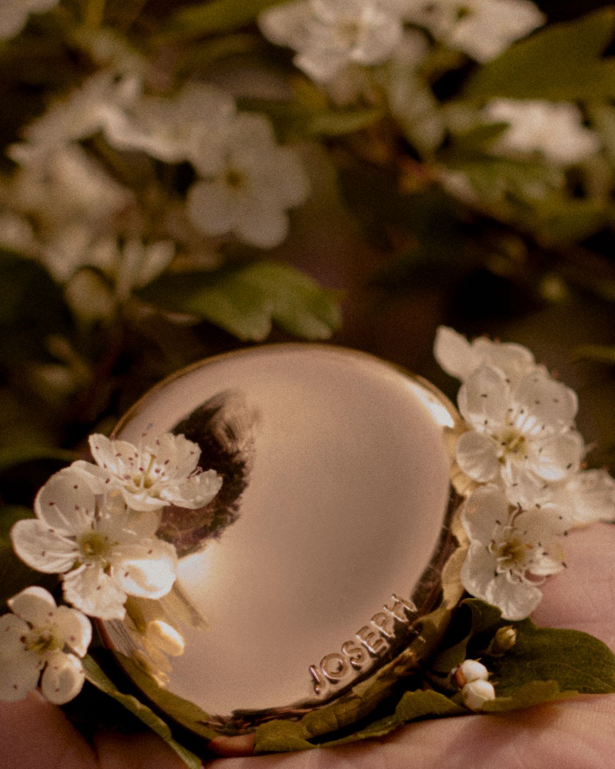 still life of an earring and flowers