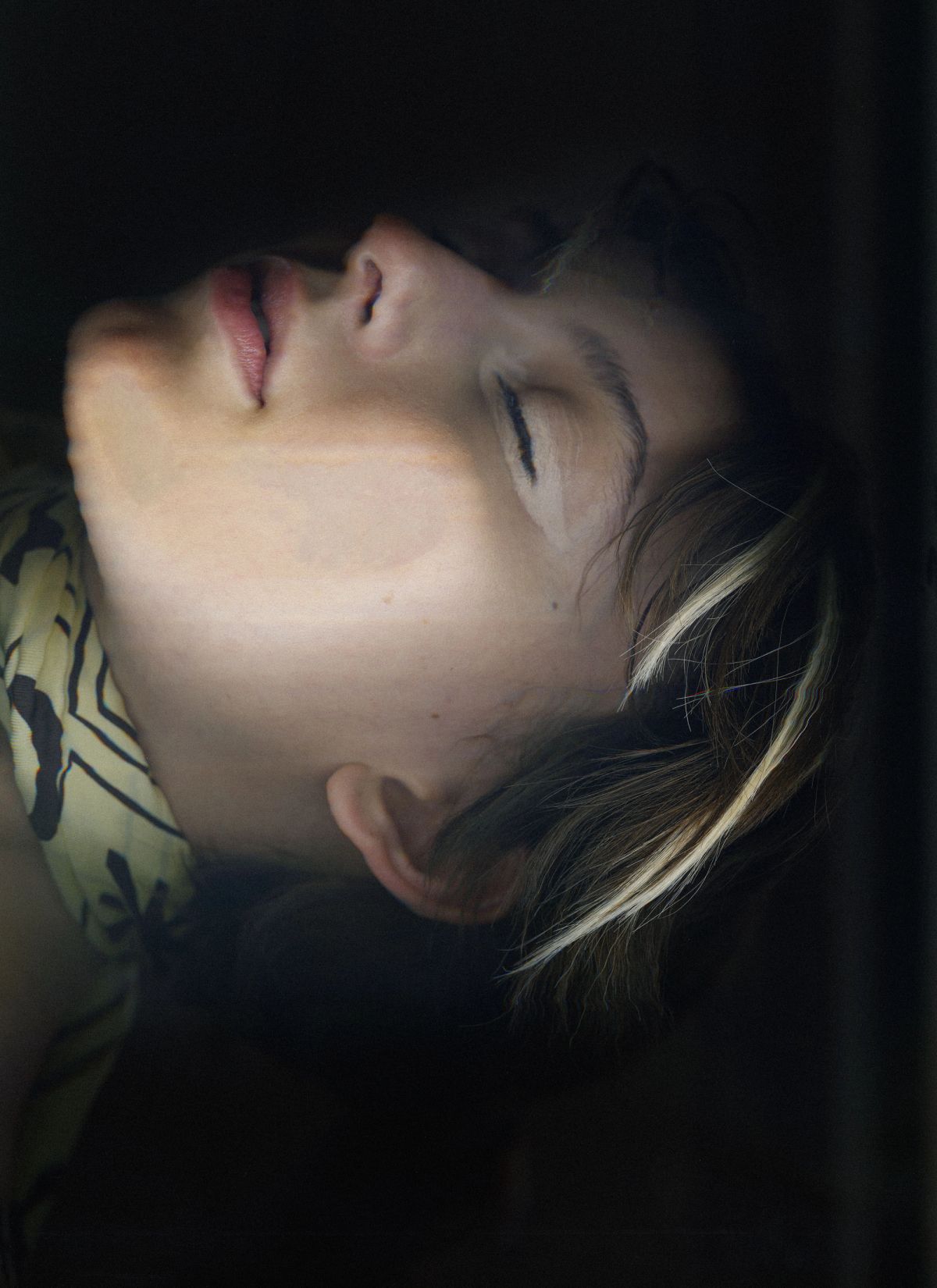 modesl face scanned wearing a yellow silk scarf