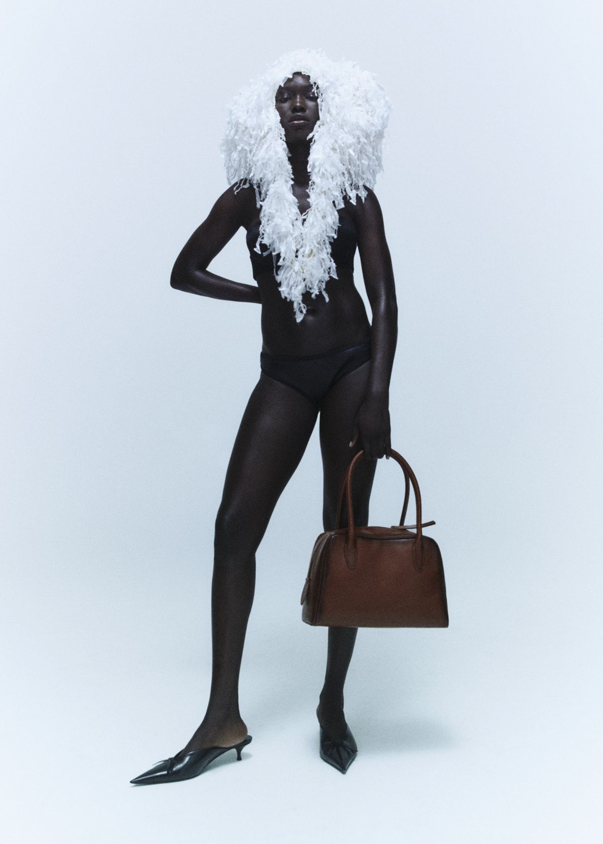 white fur and handbag 