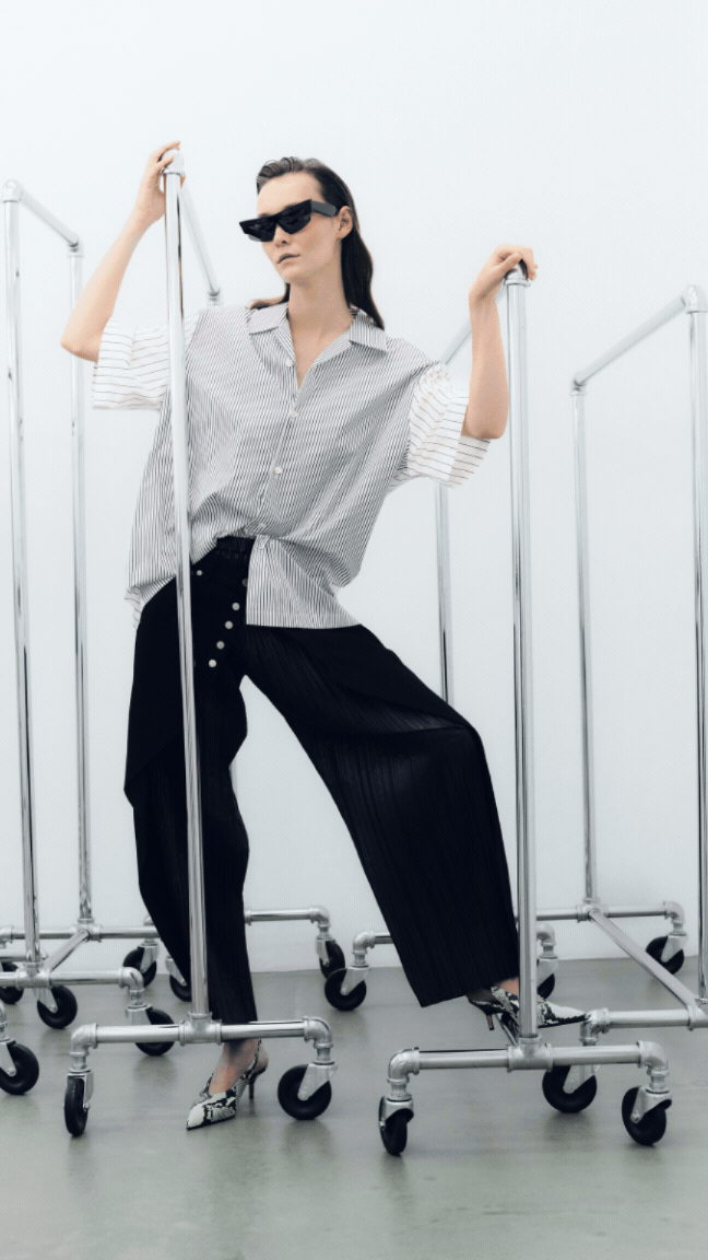 Women standing by a clothing rail