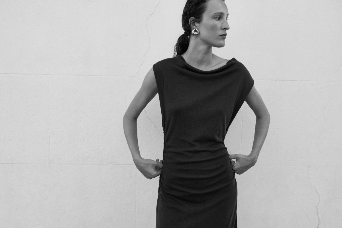 Woman standing with hands on hips