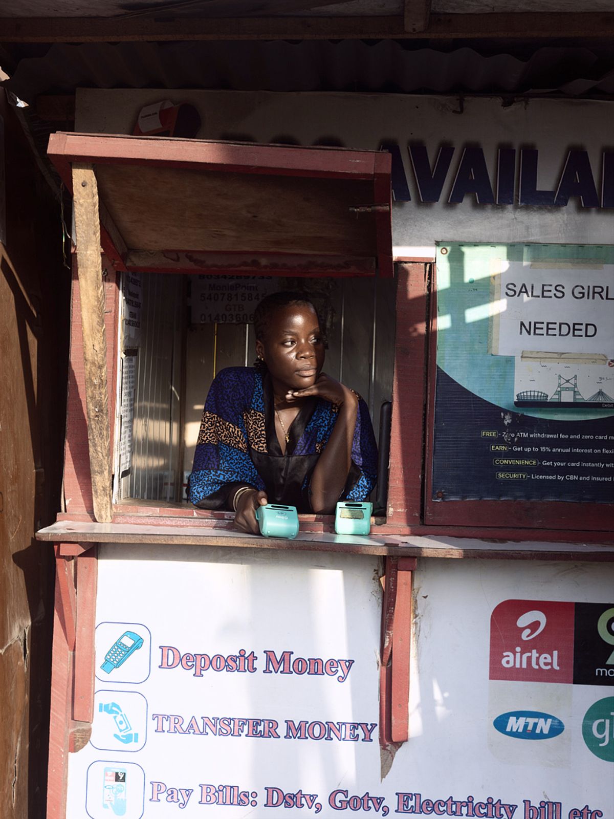 Nigerian Woman inside her POS kiosk