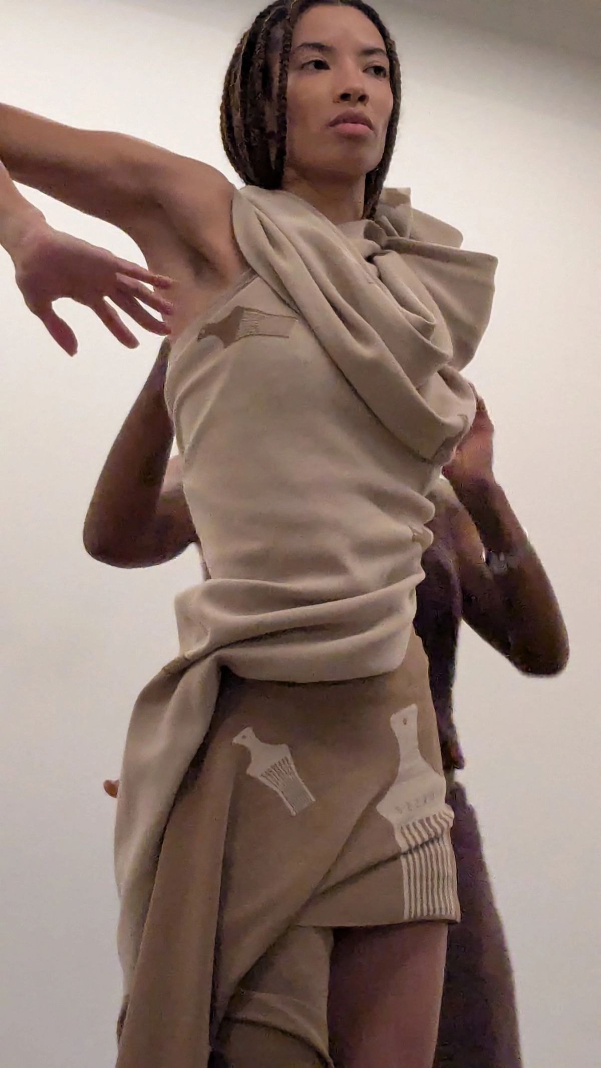 draping of being clothing on one woman to another