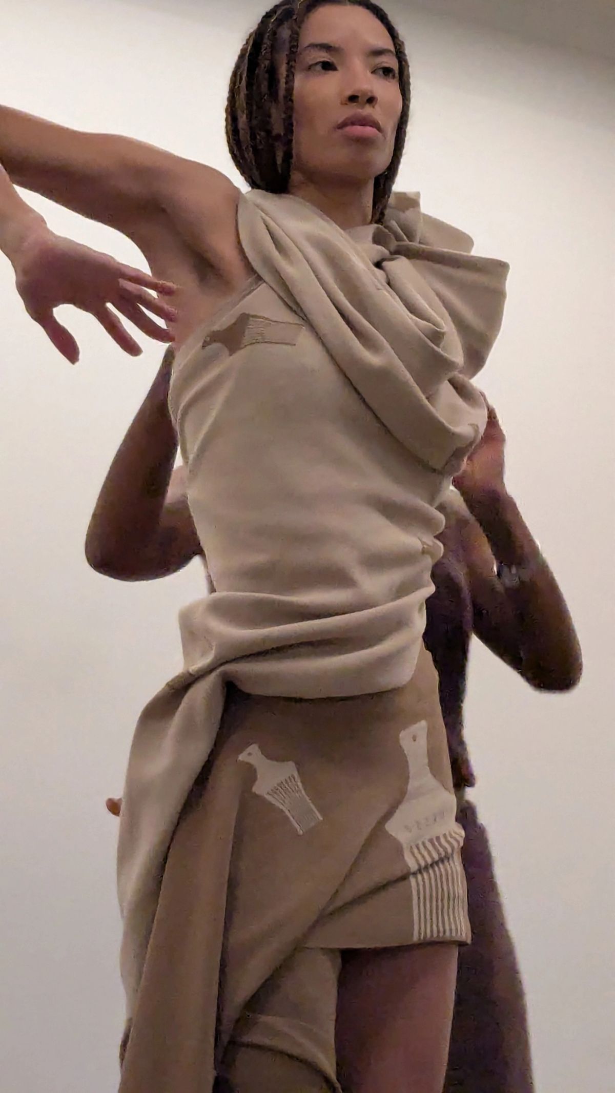 draping of being clothing on one woman to another