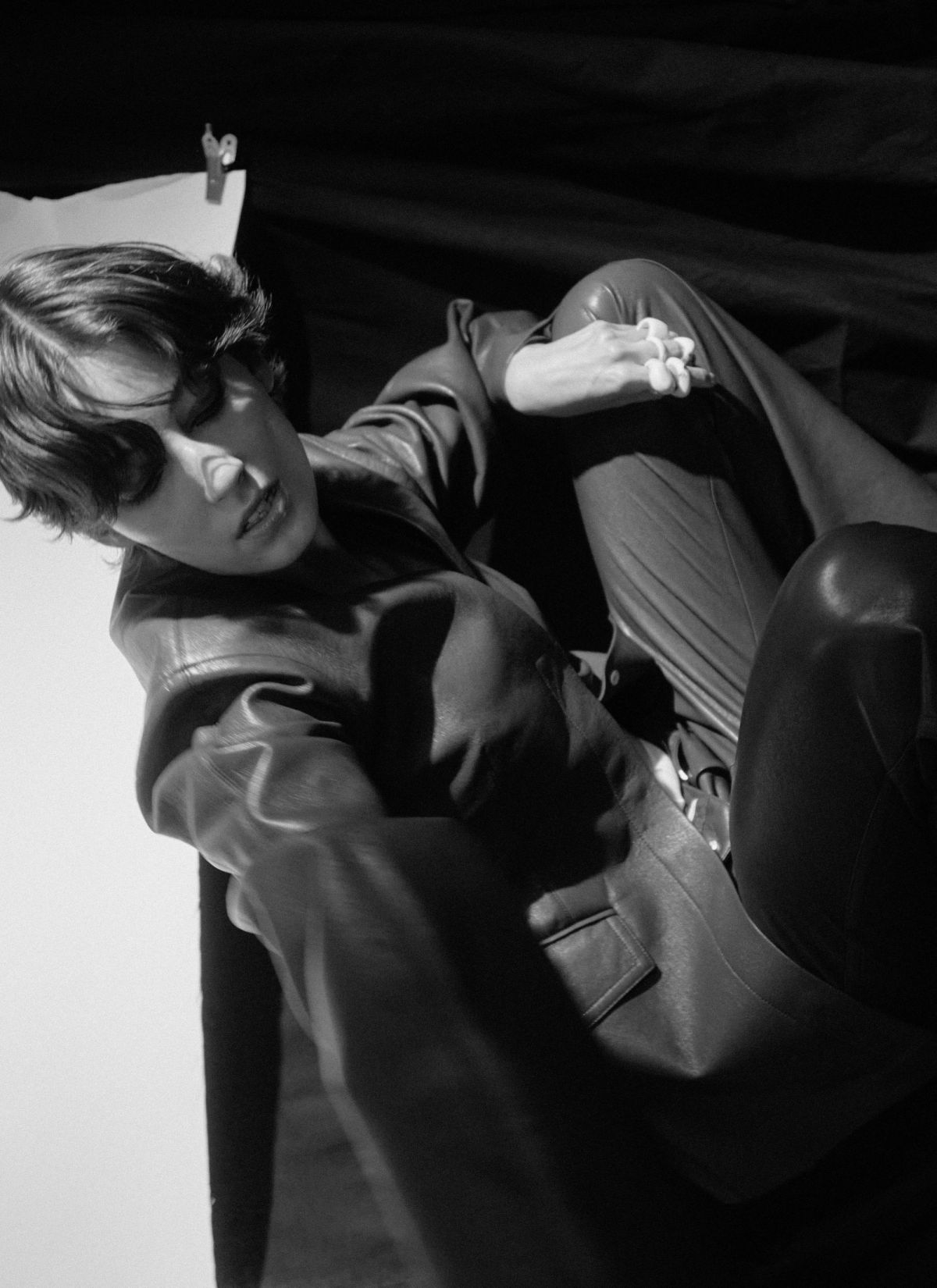 model crouching down wearing a suit