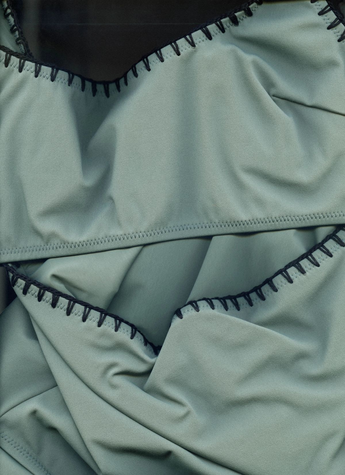 scan of a swimsuit with blanket stiching