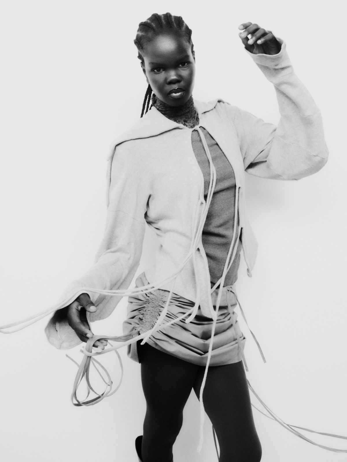 model moving on a white background wearing fringed layers