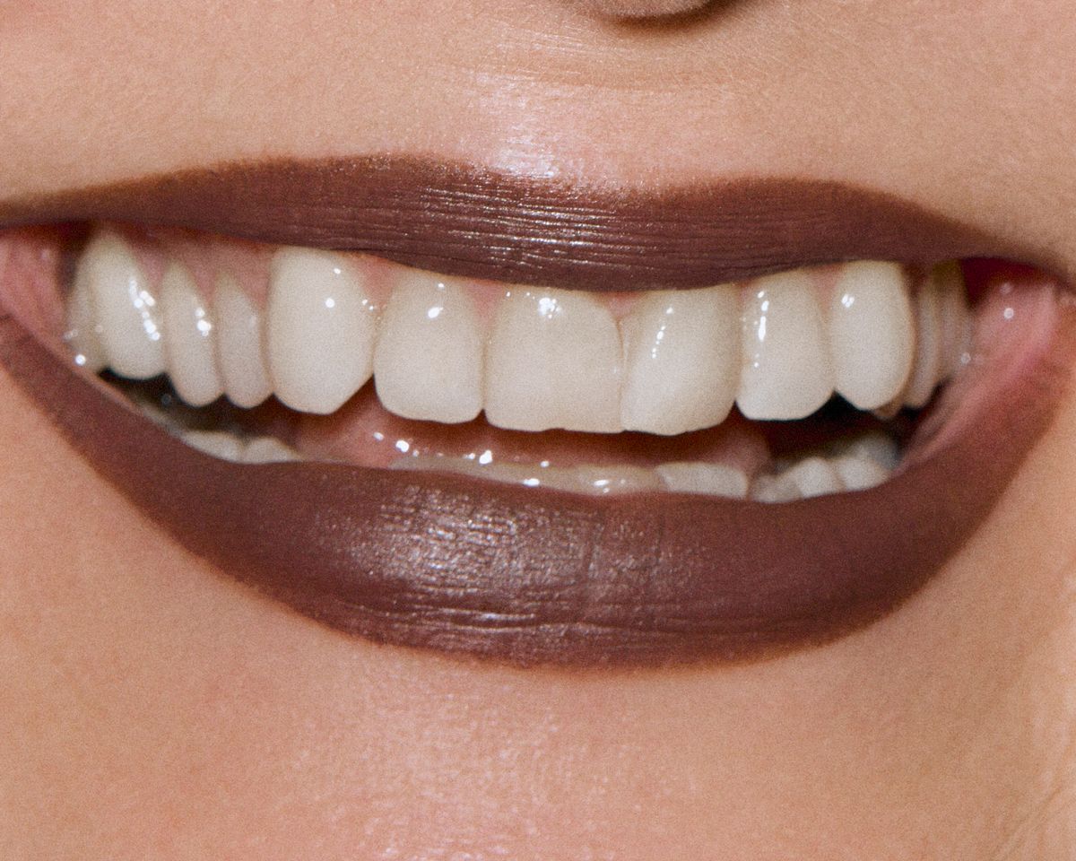 brown lipstick woonky teeth