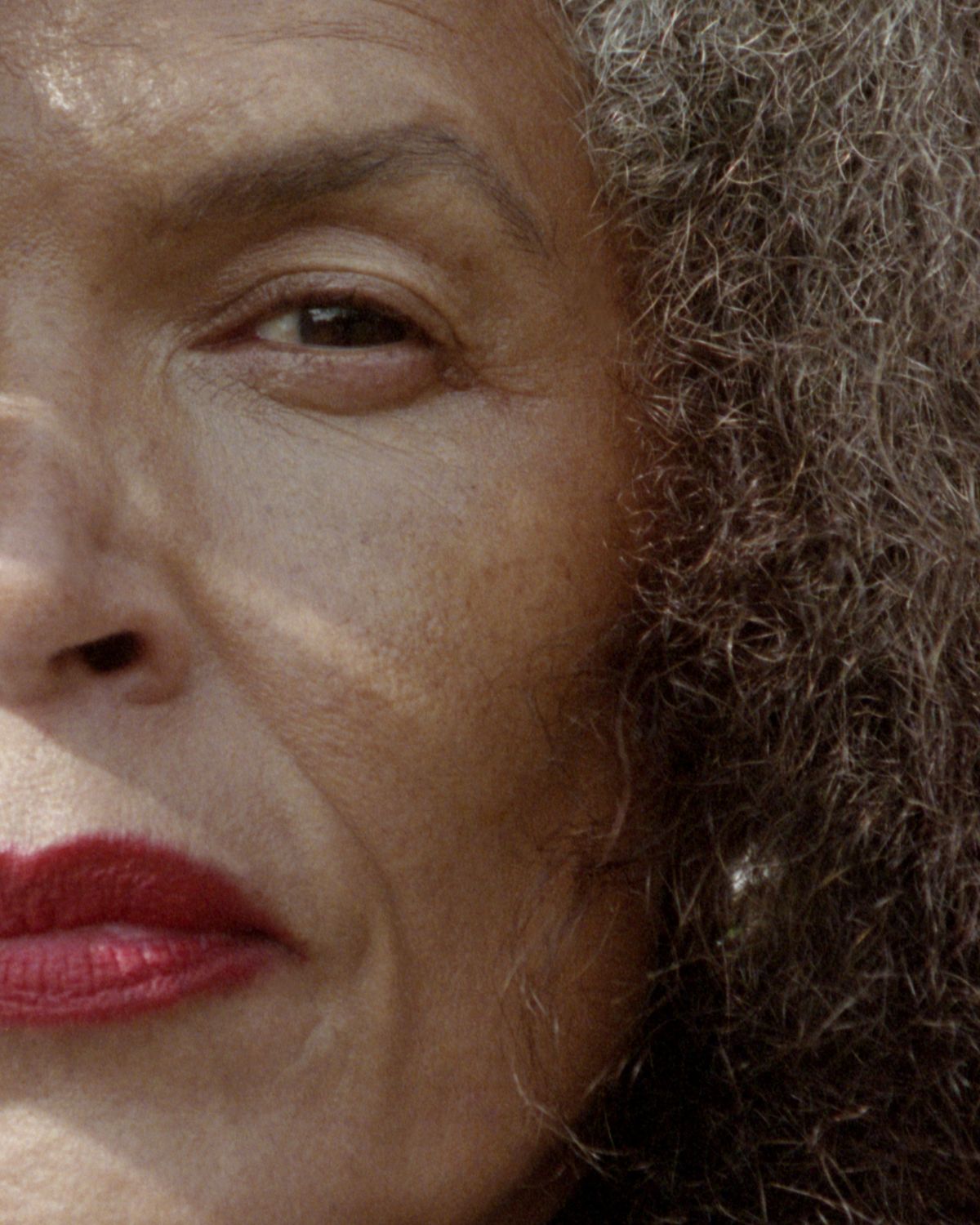 close up half crop of models face with red lips