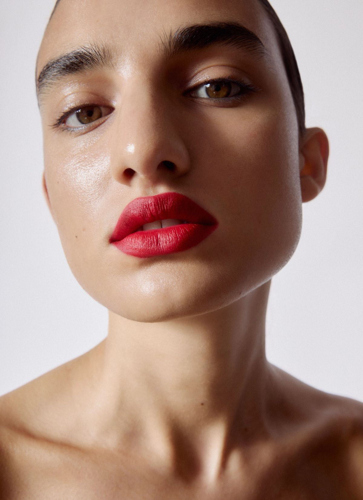 red lip and glowing skin 