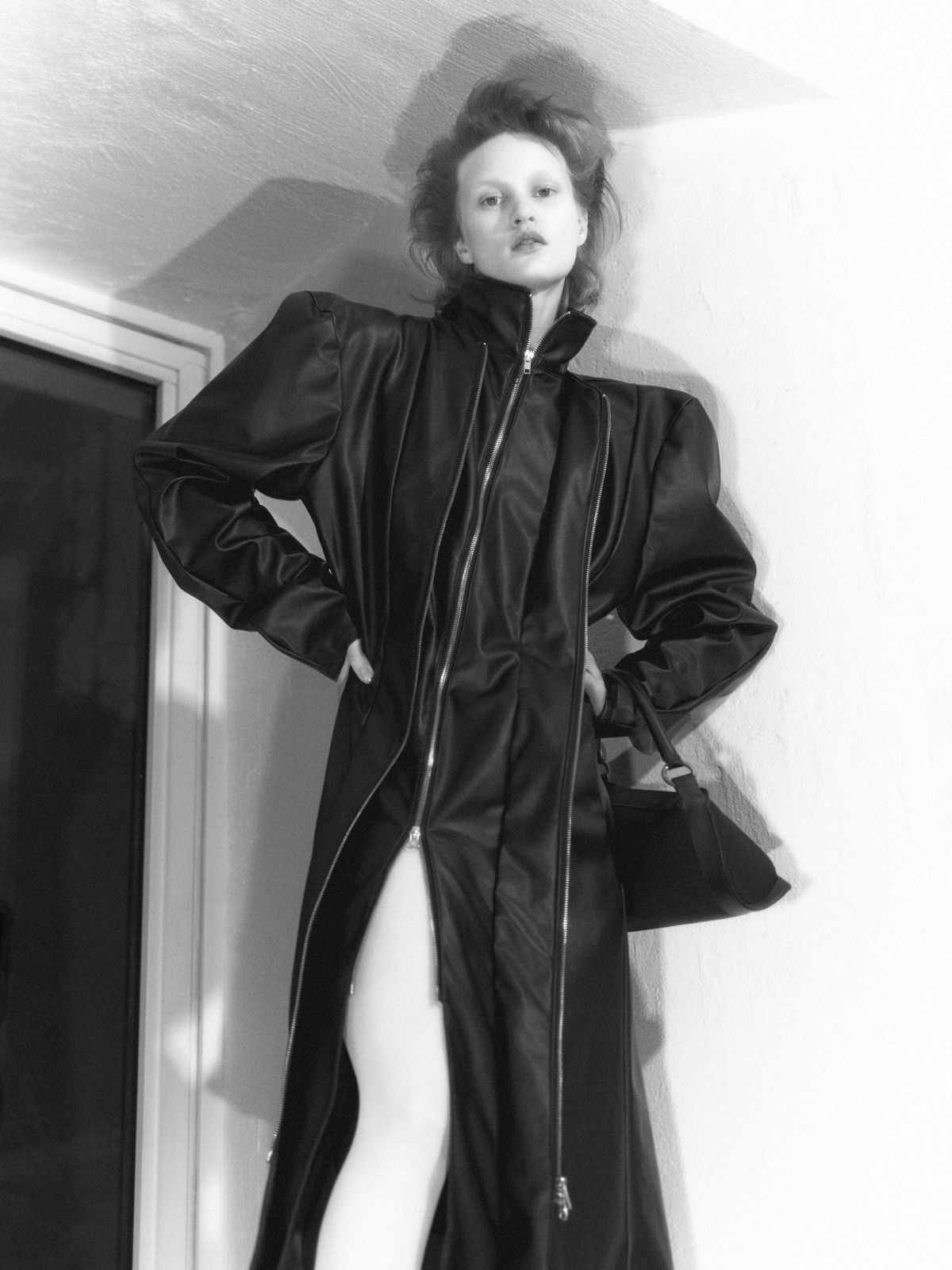 black leather coat on a model in a studio