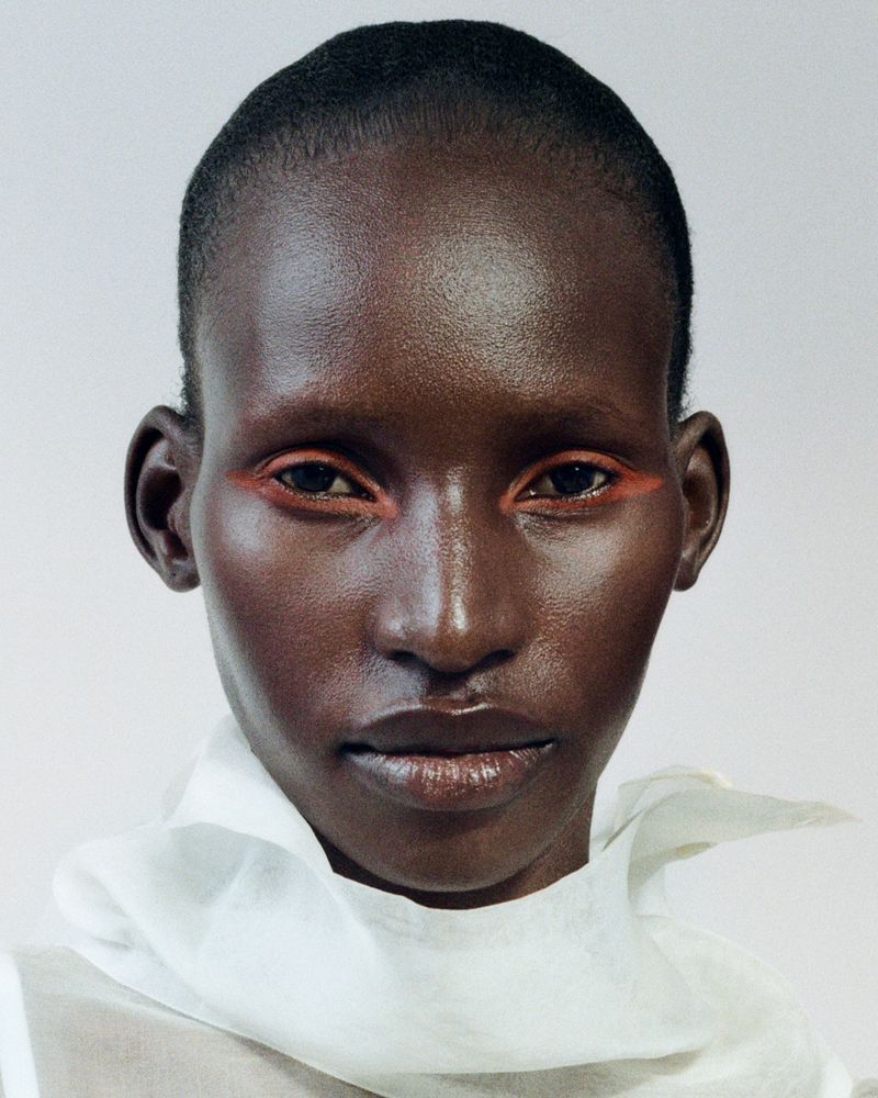 Model with orange eyeliner