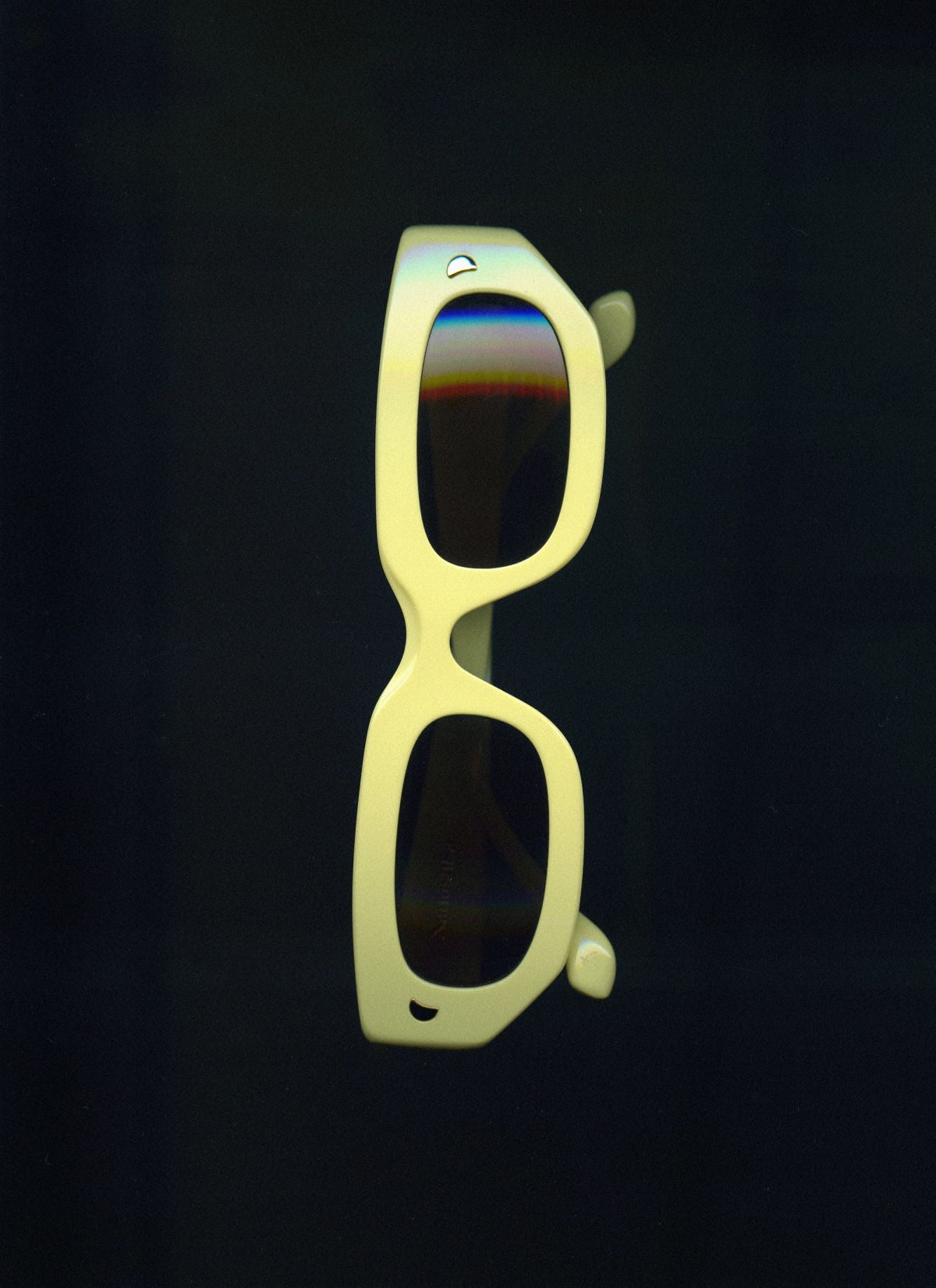 yellow sunglasses that have been scanned on a black background