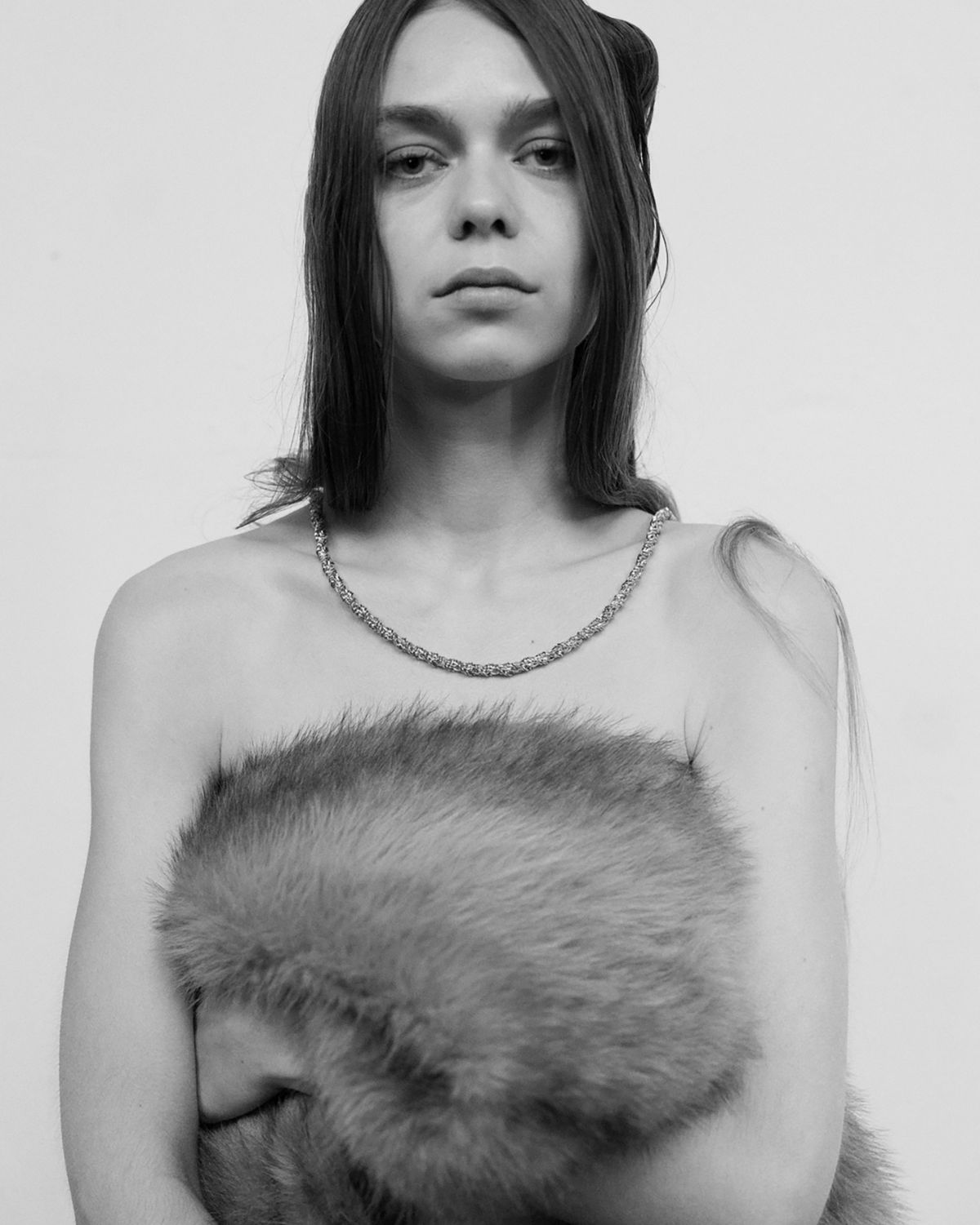 women wearing a faux fur bandeau and chain necklace