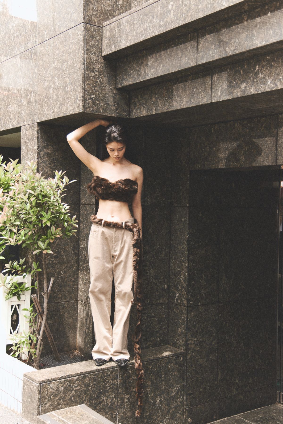 women standing on a concrete wall 