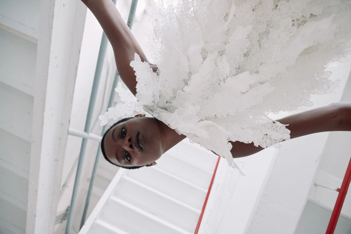 Women wearing white dress in a staircase