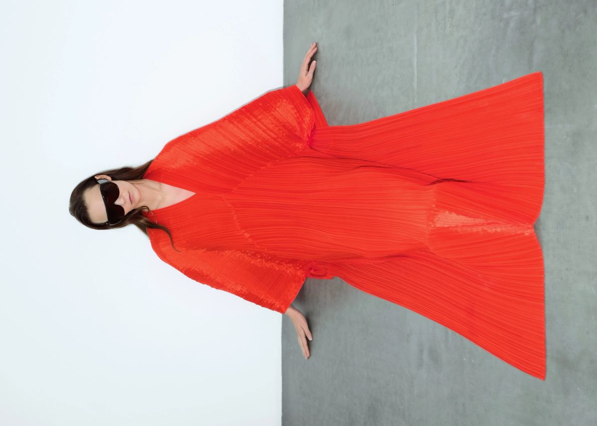Woman in a red dress and sunglasses