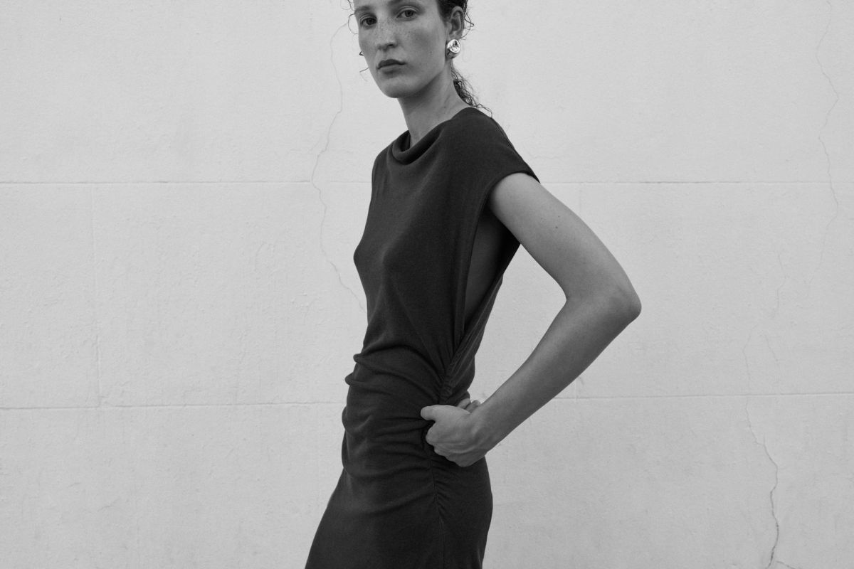 Woman standing sideways