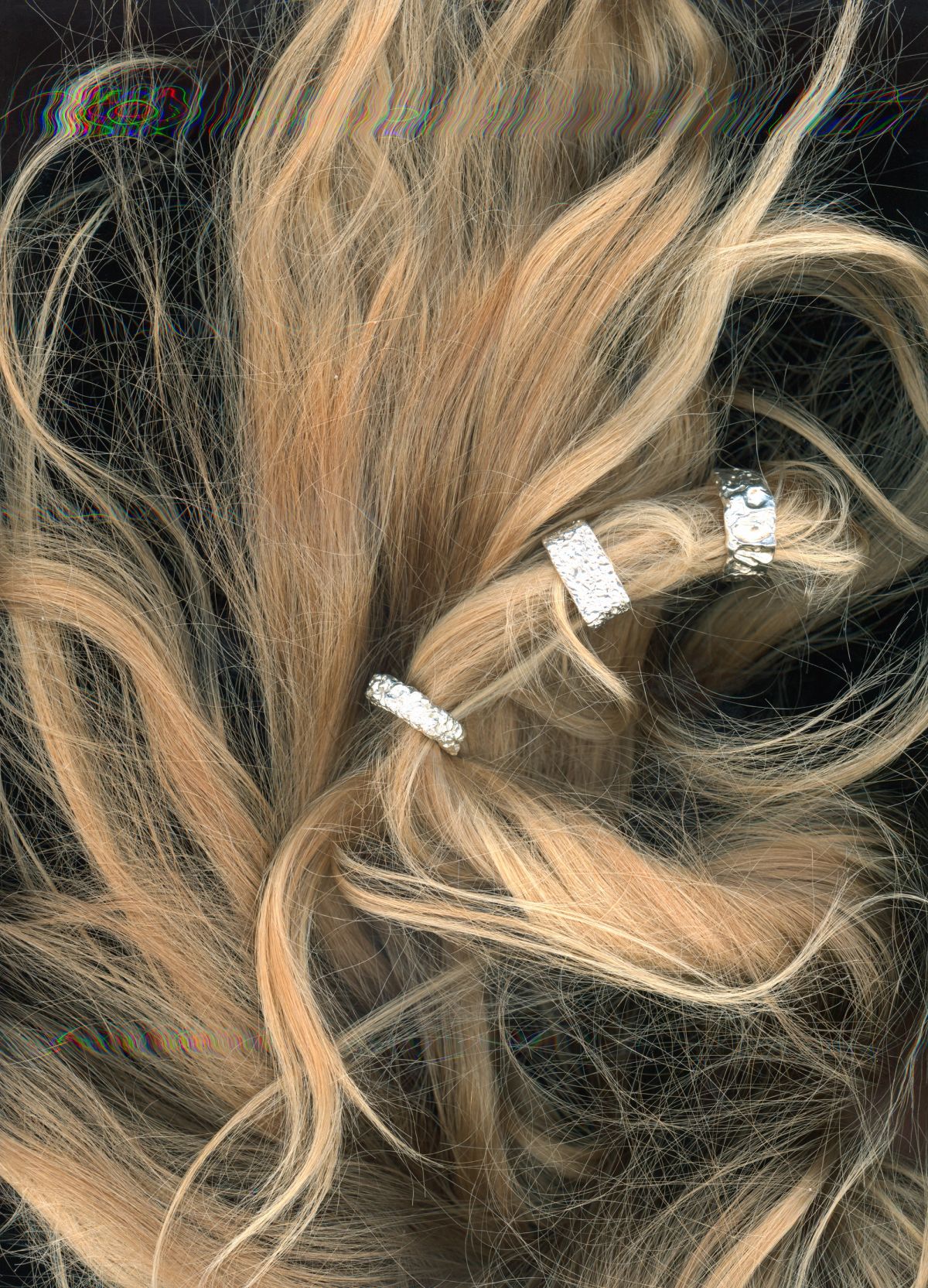 Scans of blonde hair with jewellery