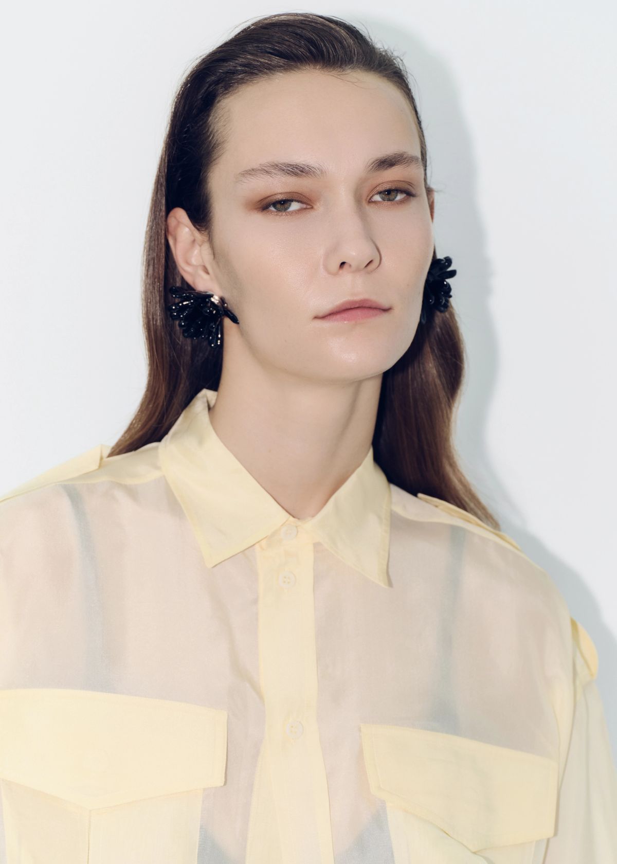 model wearing a yellow shirt