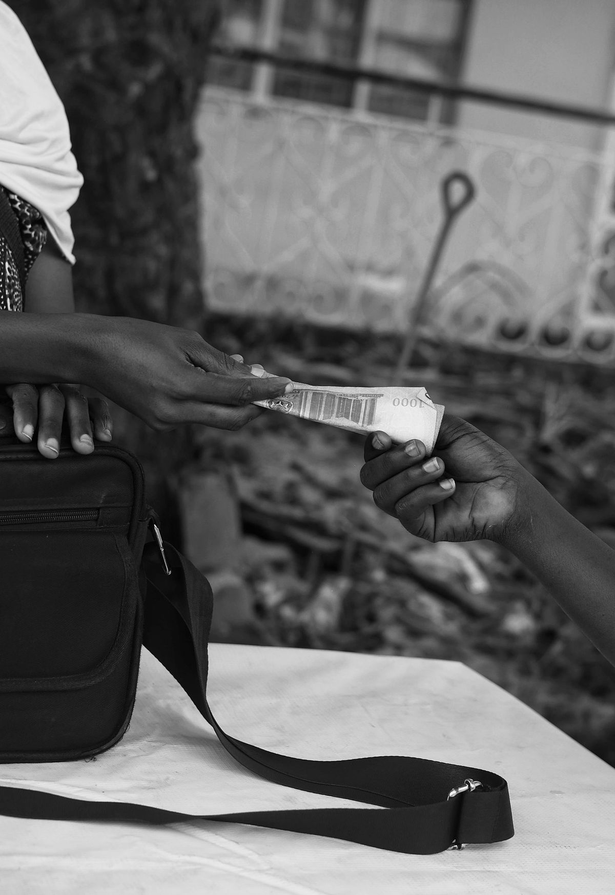 Money exchanging hands at a POS station