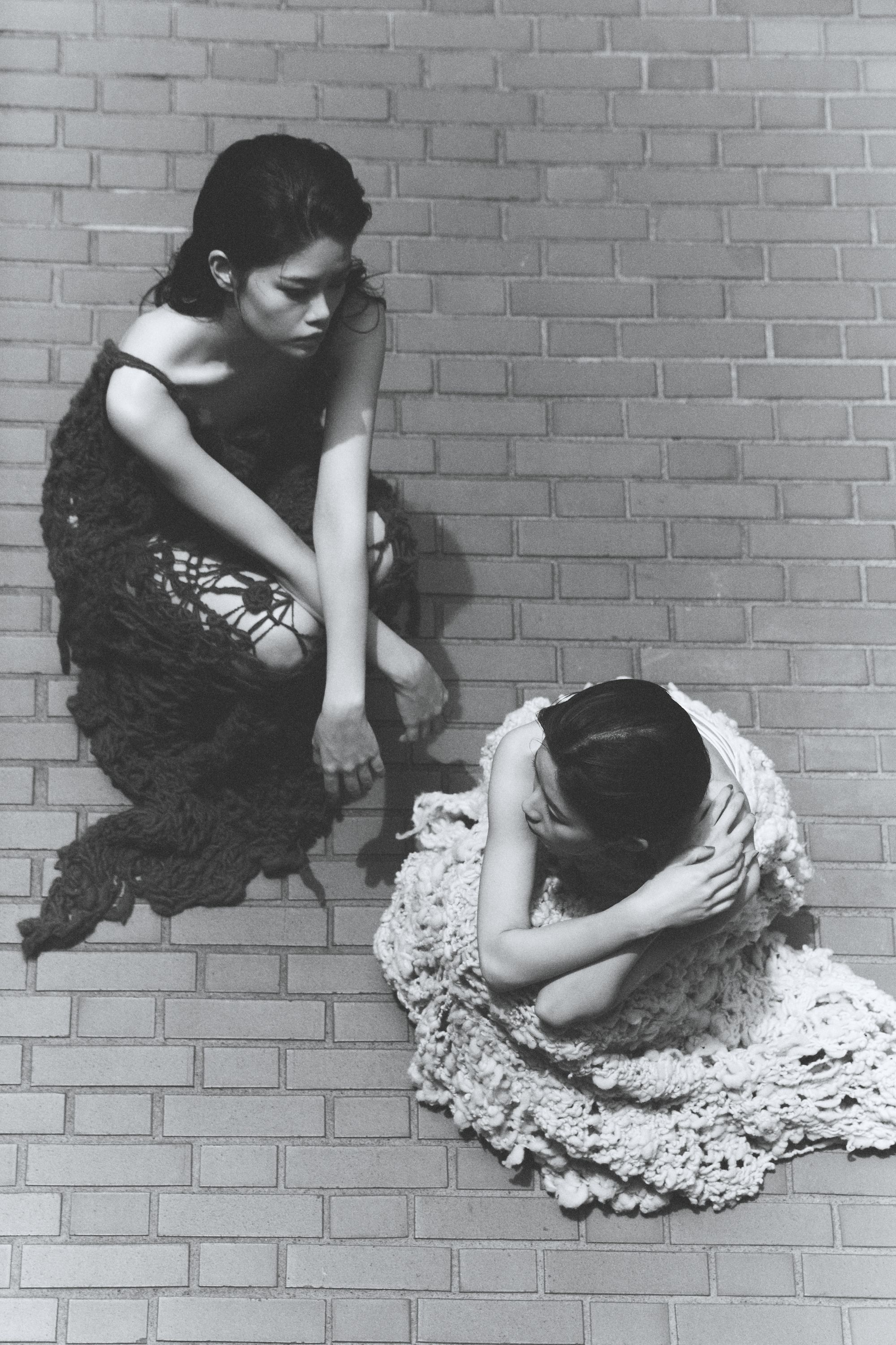 two models shot from above wearing knitted dresses