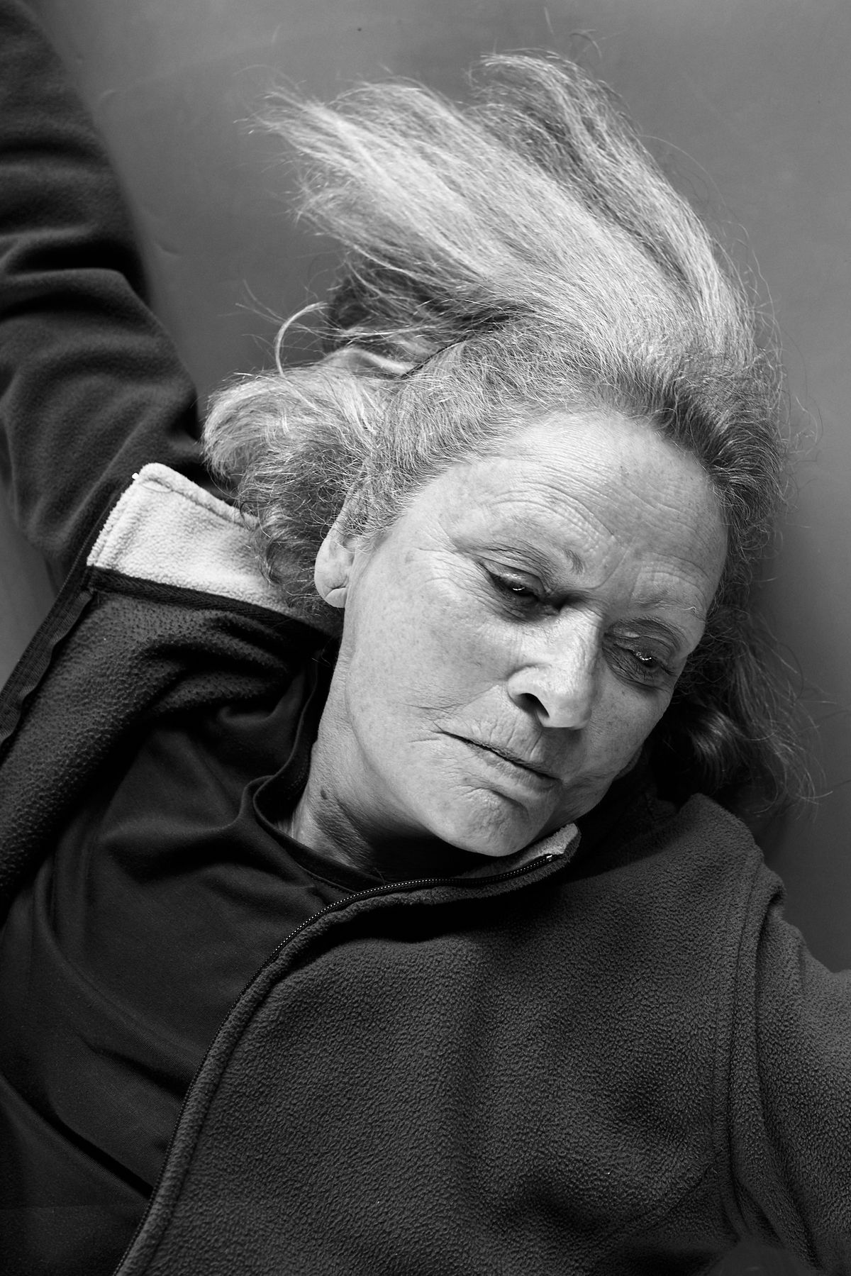 women on her back lying on the floor