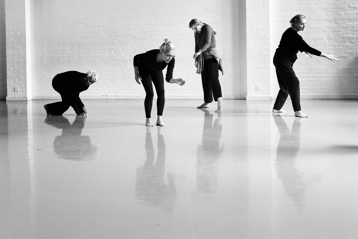 group of four dancers in different positions