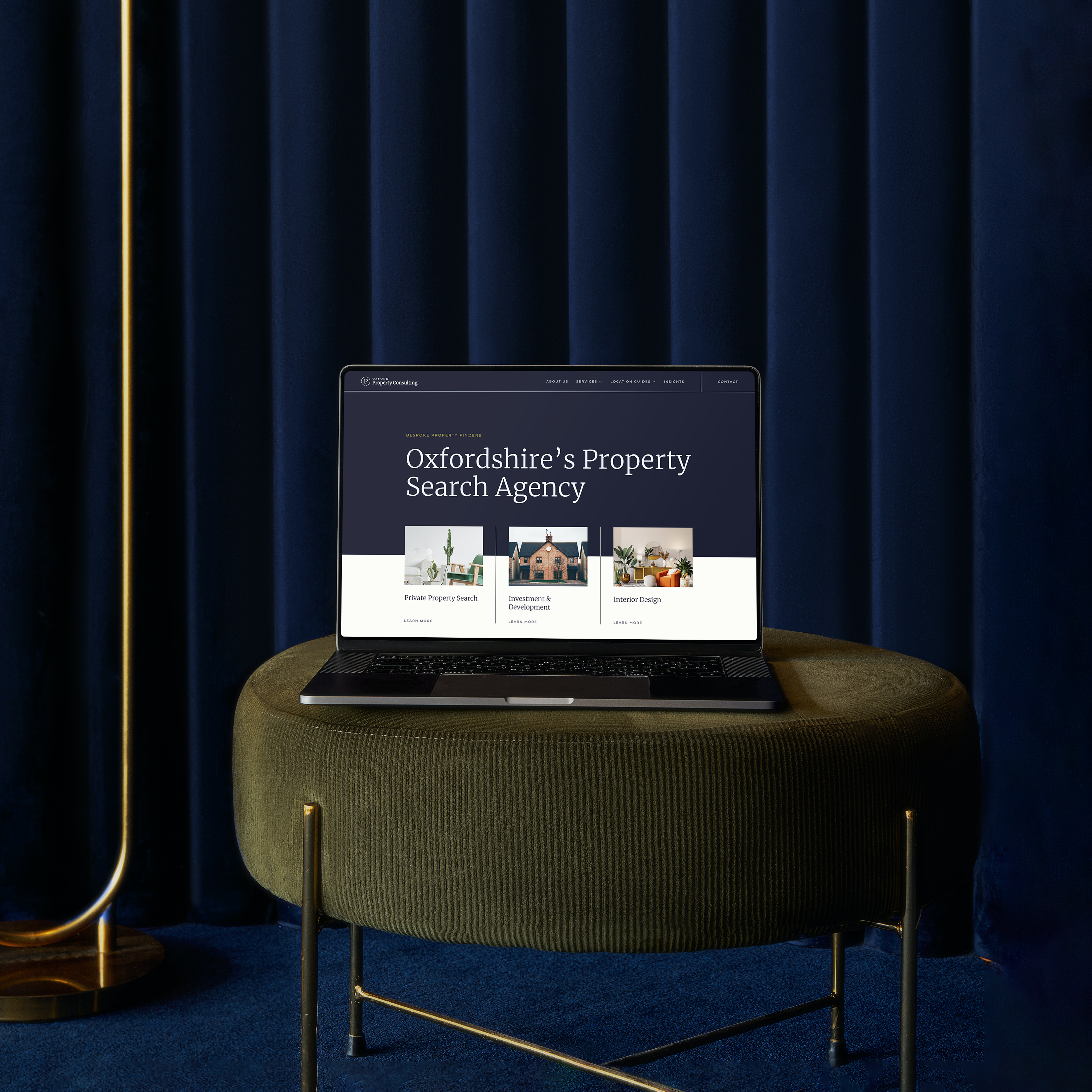 A laptop sitting on a stool showing the Oxford Property Consulting website Hero image designed and built by evensix