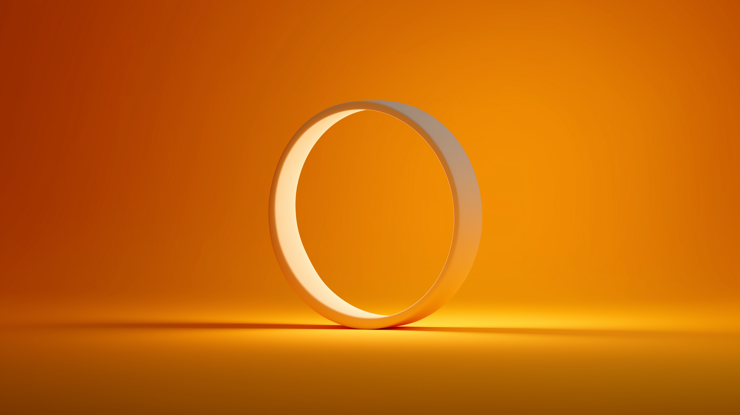 An orange ring centered on a bright yellow background, creating a vibrant contrast.