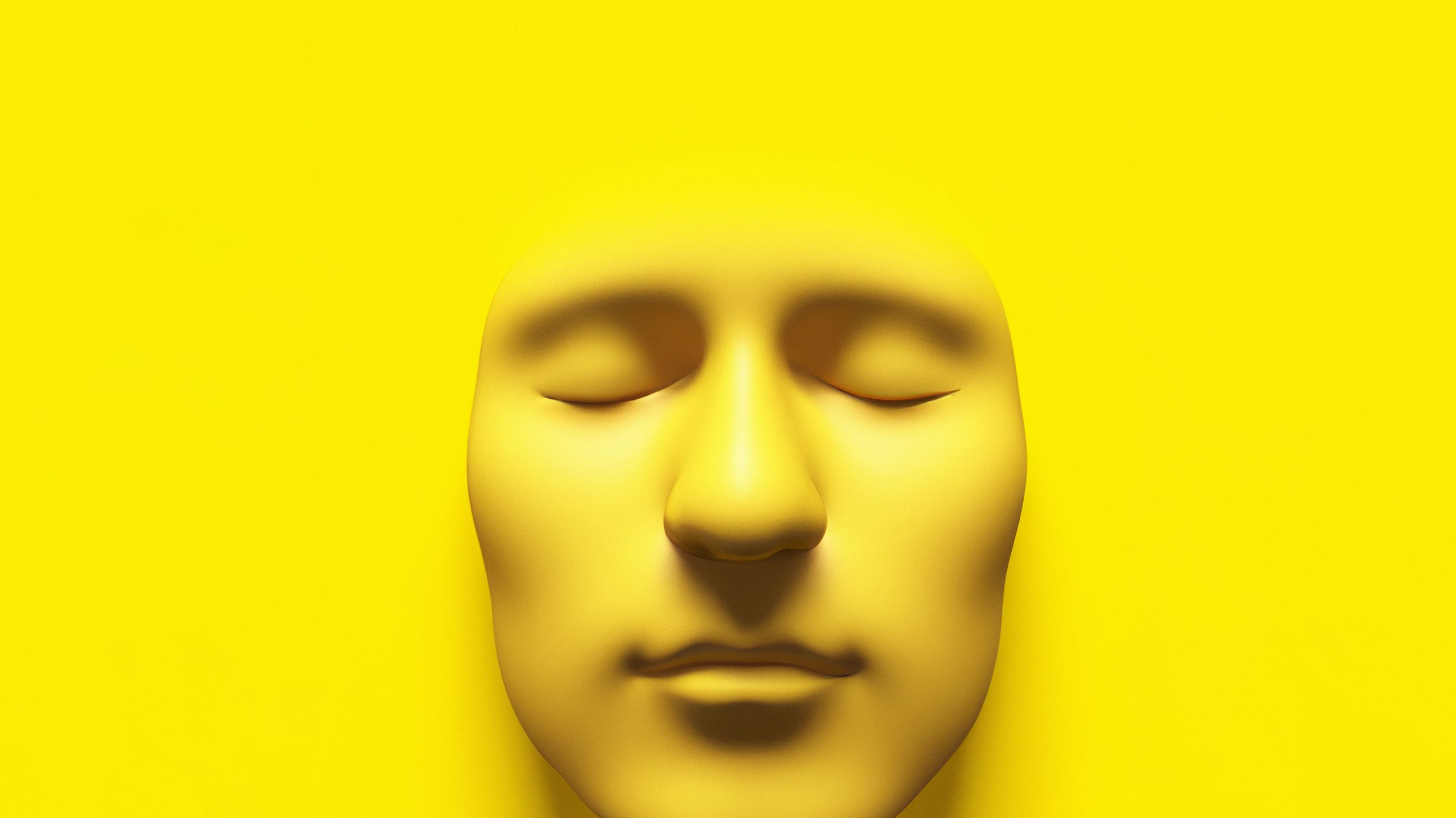 3d render of an simple face with eyes closed in a yellow environment