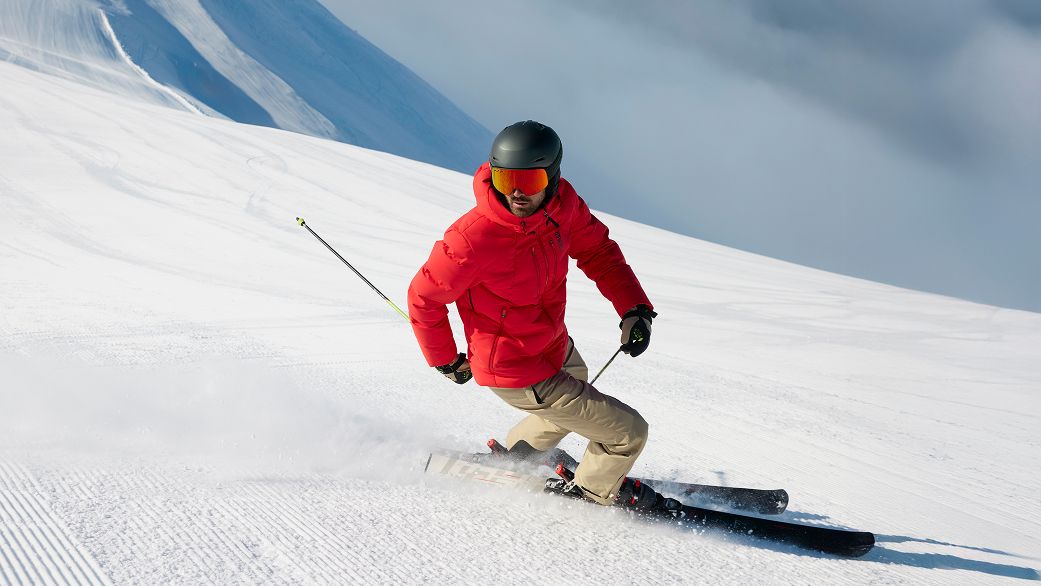 Man in ski suit in the mountains