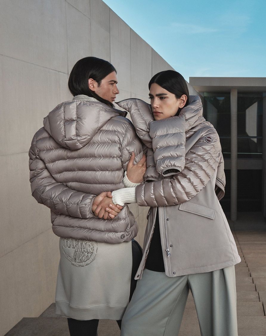 boy from behind, girl from front wearing silver jacket