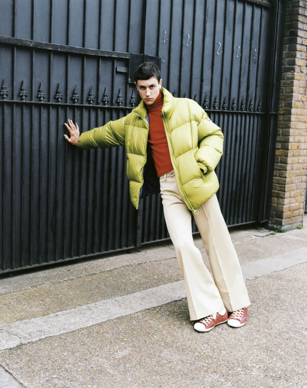 boy leaning against a doorway