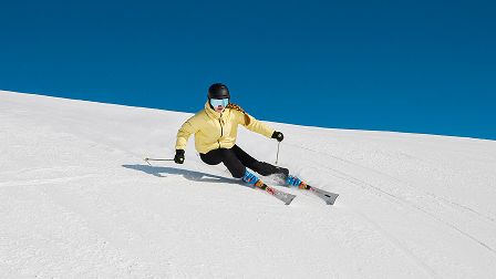 Woman in ski suit while skiing