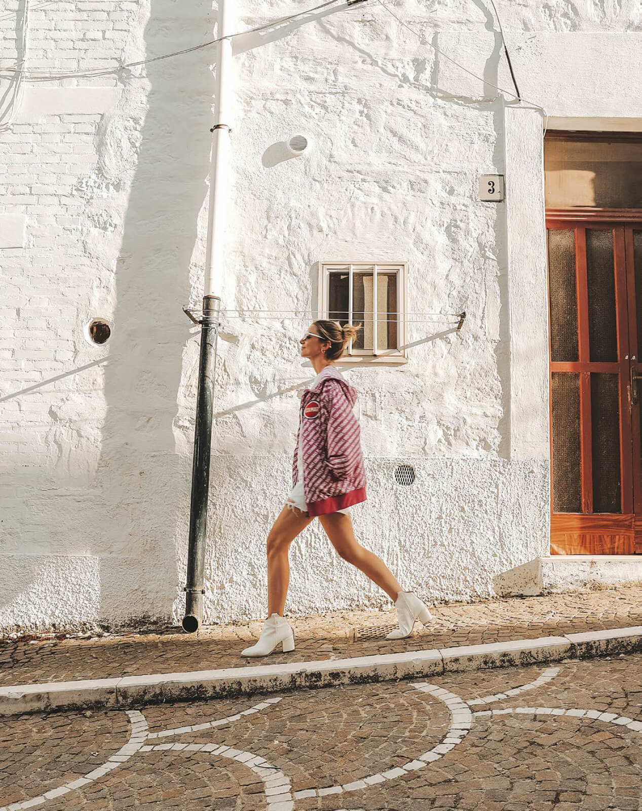 girl walking in a small village