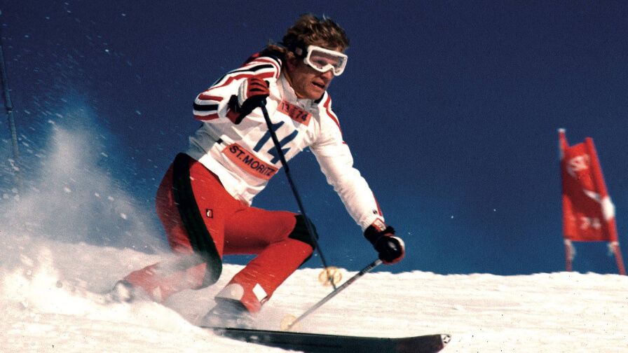 70s man racing with skis