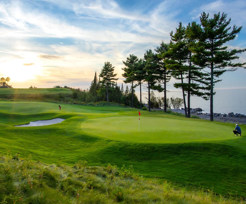 A green and bunker at Bay Harbor Golf Club.