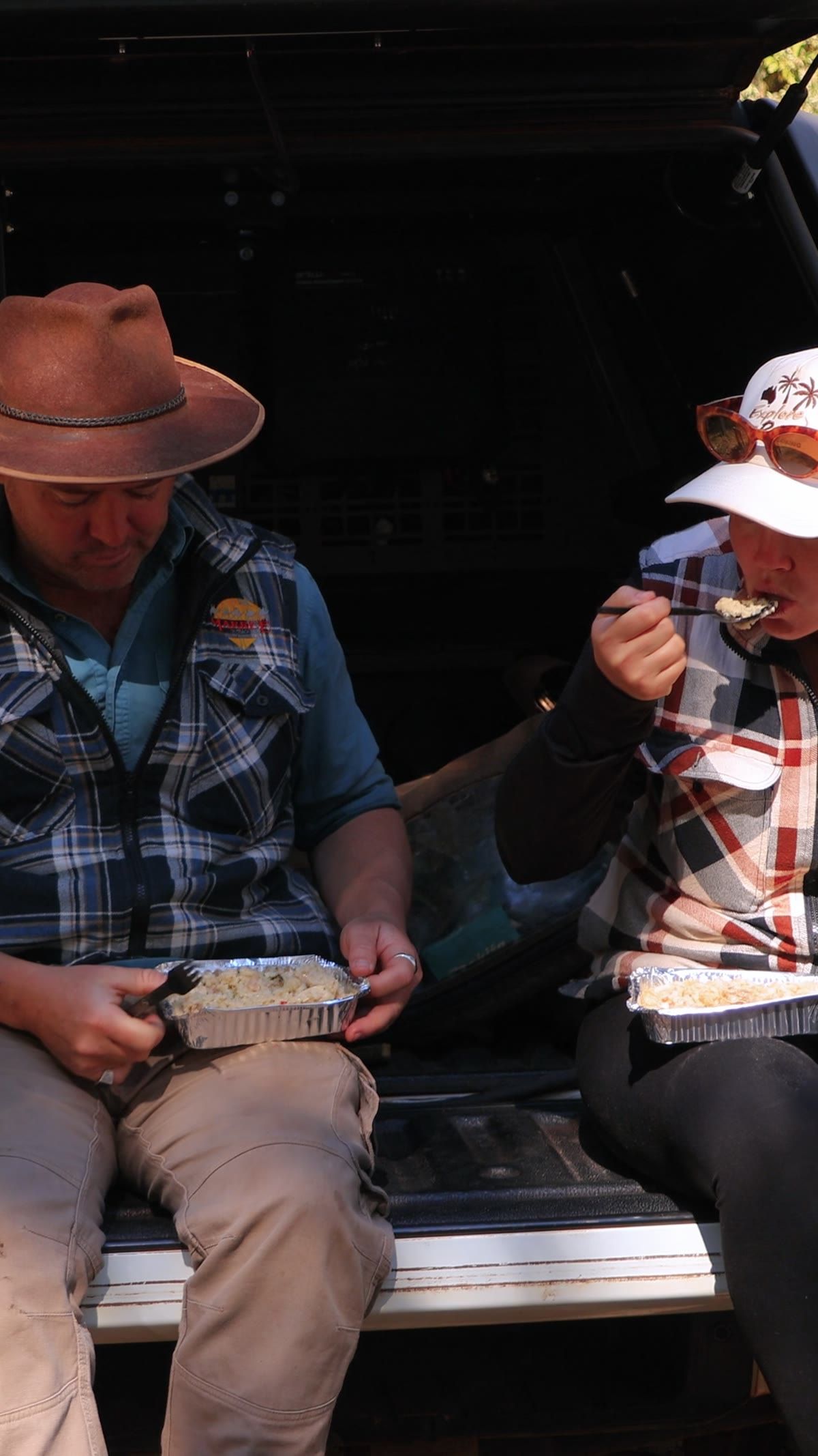 Jess and Allan from ExploreOz having a meal at the open D-MAX canopy