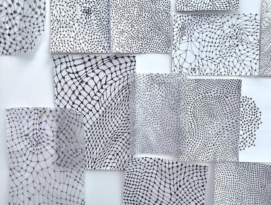 Mesh Drawings on the studio wall hung randomly