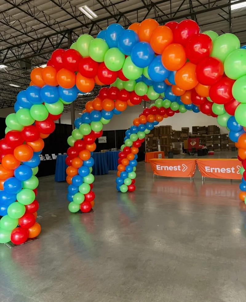 Colorful balloon arch decoration at corporate event