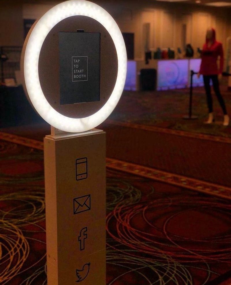 SocialBoothLV digital photo booth kiosk with ring light at a Las Vegas hotel corporate event