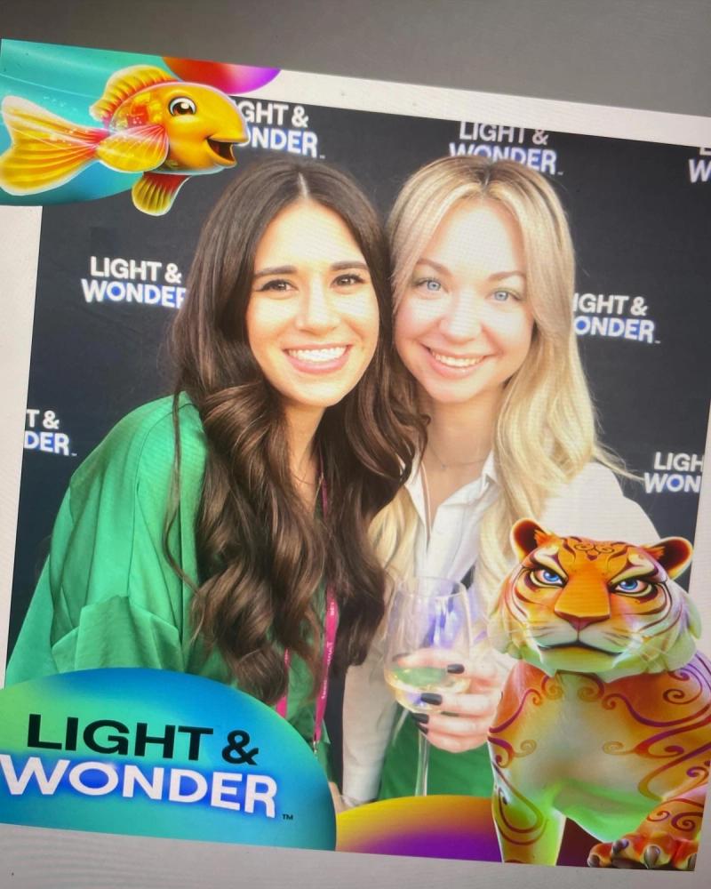 Corporate photo booth activation for Light & Wonder at a Las Vegas convention with branded overlay