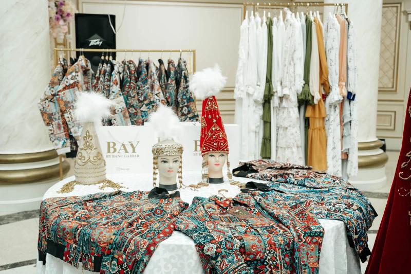 A display of BAY bombers, national headdresses and BAY bags