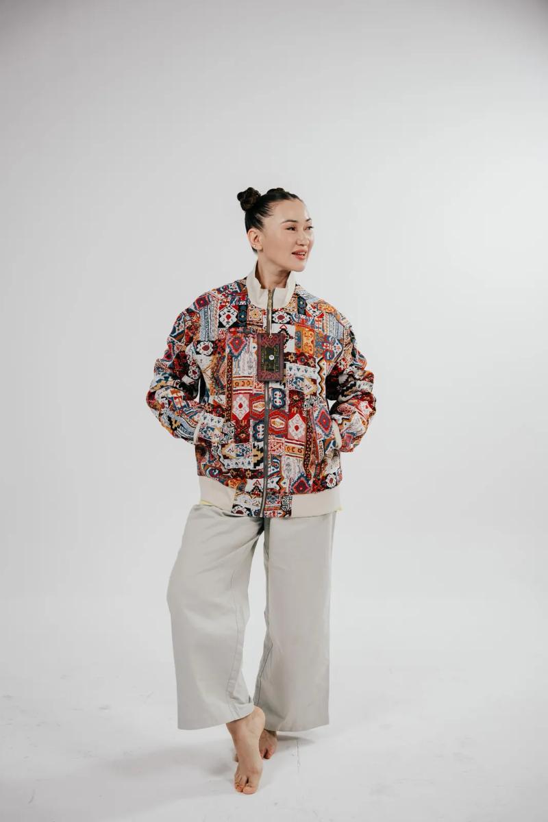 Banu Gaidar in a BAY bomber and wide trousers, full length