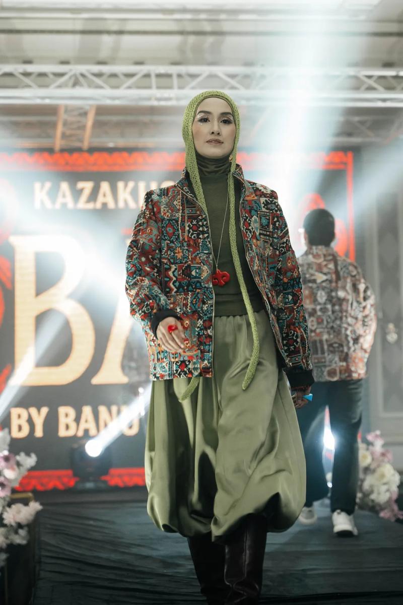 Model in a BAY bomber and an olive hood on the runway