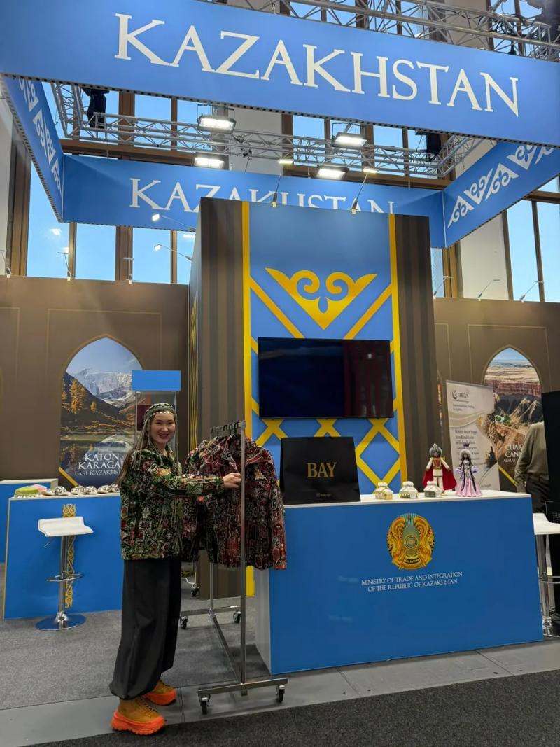 Banu Gaidar shows a BAY bomber at the Kazakhstan stand