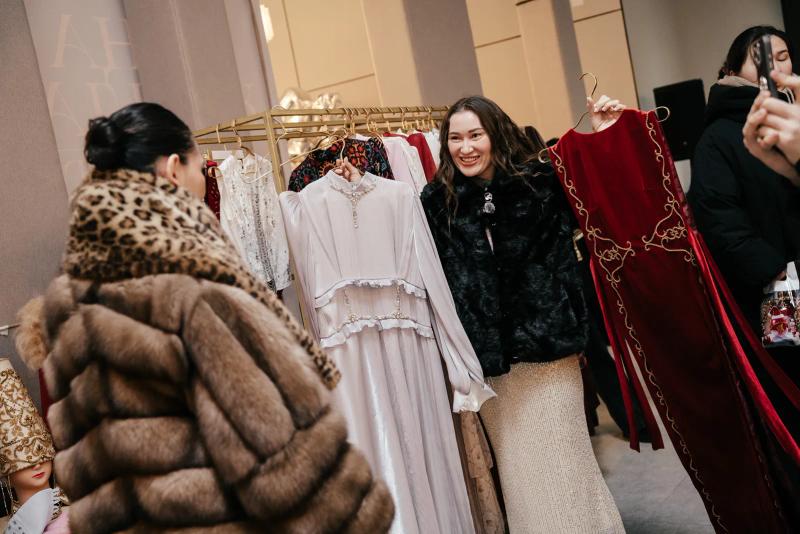 Banu Gaidar by a rail of dresses